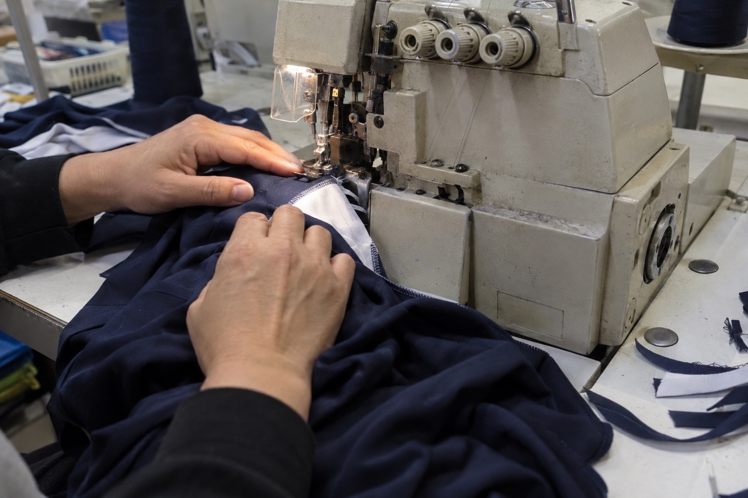 Illustration of an operator sewing a sportswear seam