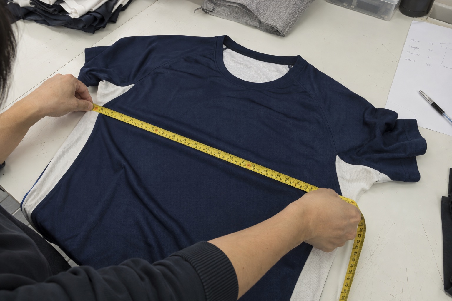 Illustrative sample review with a sports shirt and measuring tape