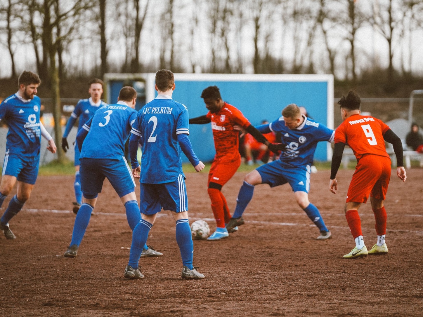 Football players training on a grass pitch
